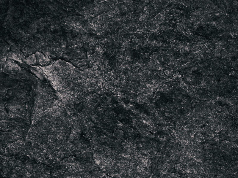 Fotobaggrund af sort sten